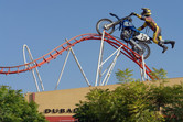 Giant biker on giant coaster track