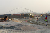 Yas Island workers in the foreground, Formula Rossa in the background