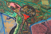 Red Ferrari World building in the middle, Warner Brothers Park and water park on the left