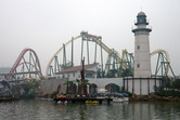 Lighthouse and coaster in the smog