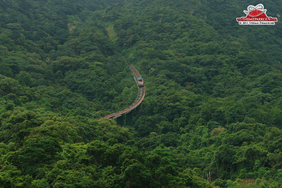 Massive funicular railway racing upwards through the jungle