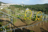 View from the coaster peak: in the background you can spot the famous Ryugyong Hotel!