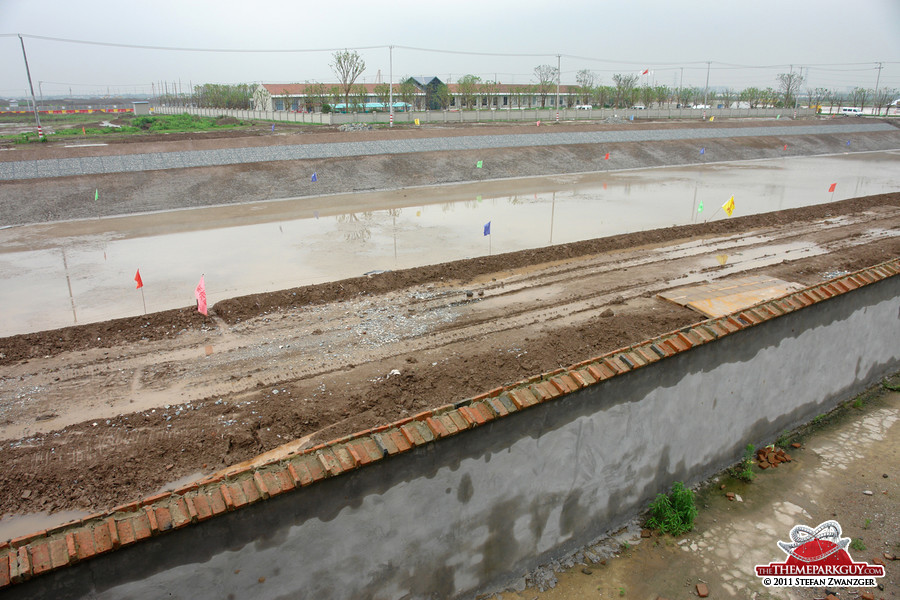 Wall at the front, moat in the middle, office at the back