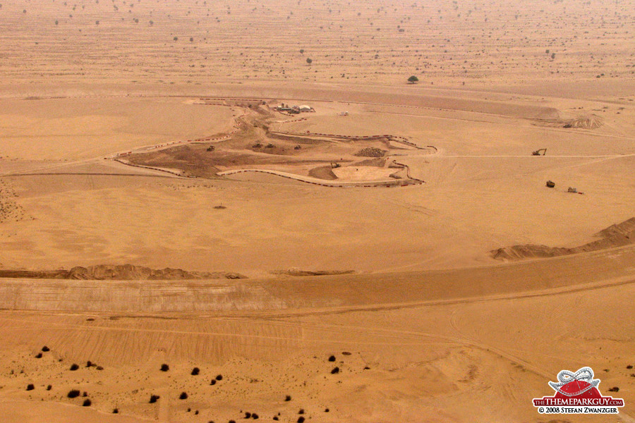 The hole in the middle of the circular sand wall...