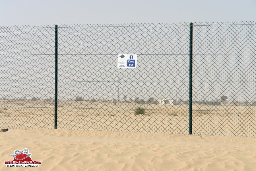 A little signboard on the fence