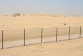 Look over the fence: you can see the circular sand wall...