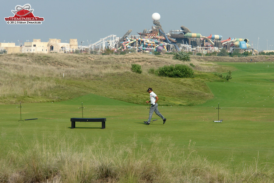 Yas Island golf course with Yas Waterworld backdrop