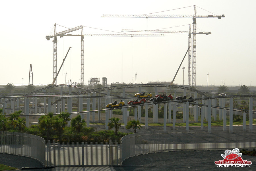 Ferrari World dueling coaster at the front, water park cranes at the back