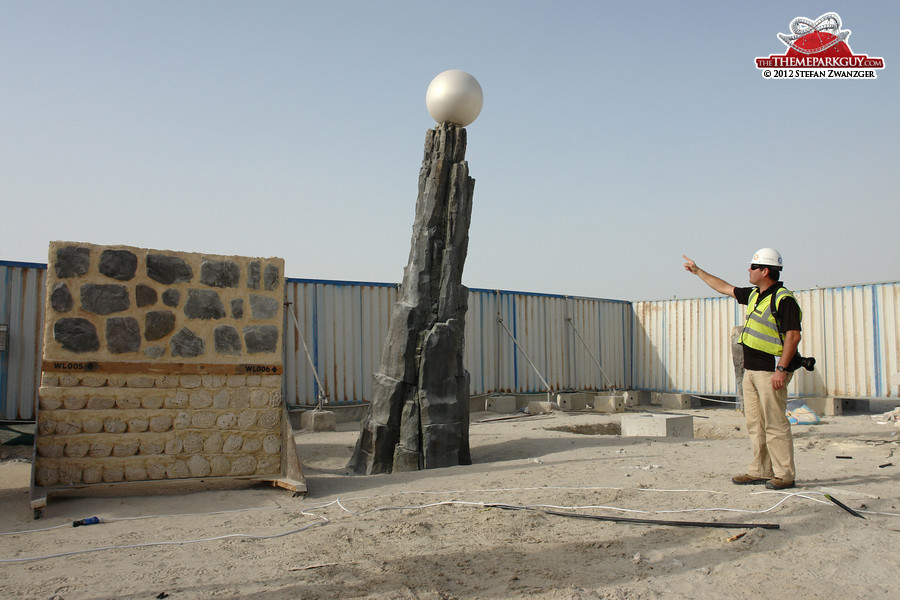 Design manager Mark Joyce points to a mock-up of the park's central structure