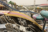 Freshly crafted rockwork among the slides, with Ferrari World in the background